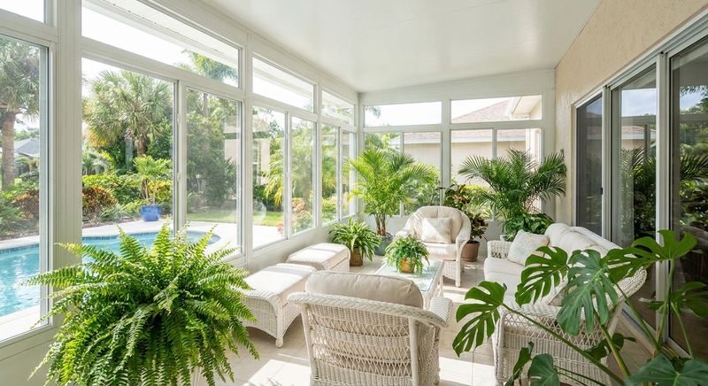 Sunroom addition with glass walls on a Florida home