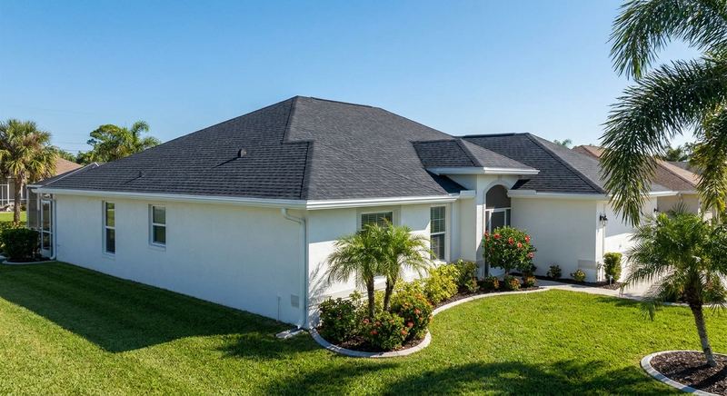 Clean Gainesville FL home exterior with new roof and gutters by Trini Homes